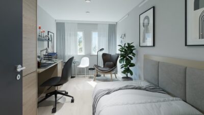 Helles, voll möbliertes Studentenapartment im Staytoo München mit Bett, Schreibtisch und Sitzecke am Fenster