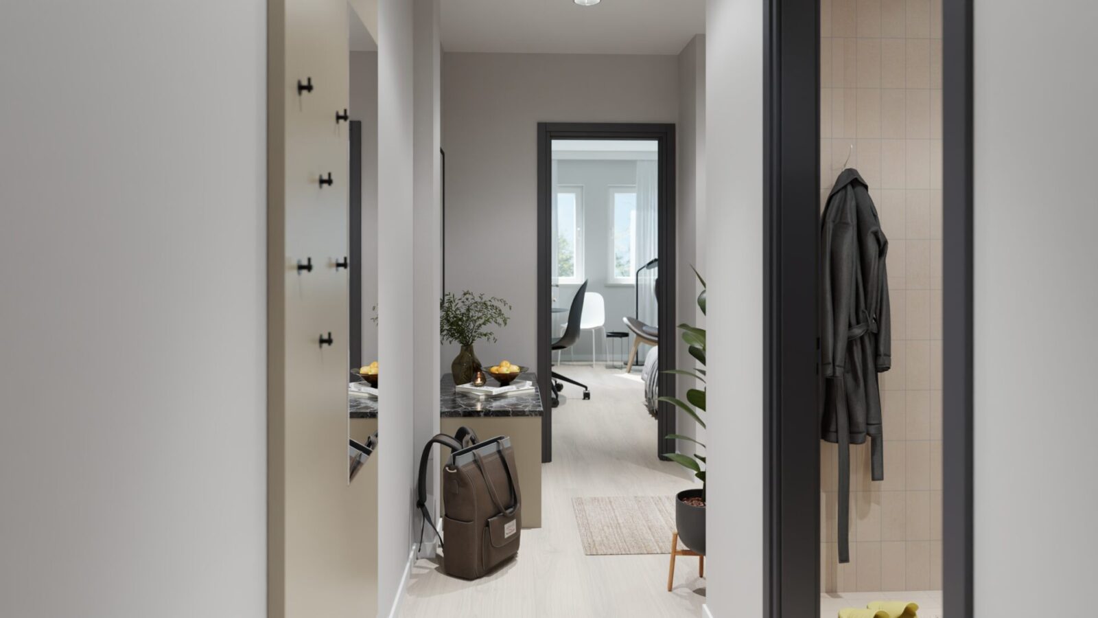 Flur eines Studentenapartments im Staytoo München mit Garderobe, Blick ins Bad und in den Wohn- und Schlafbereich